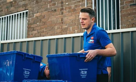 vmove sydney removalist worker with plastic crate